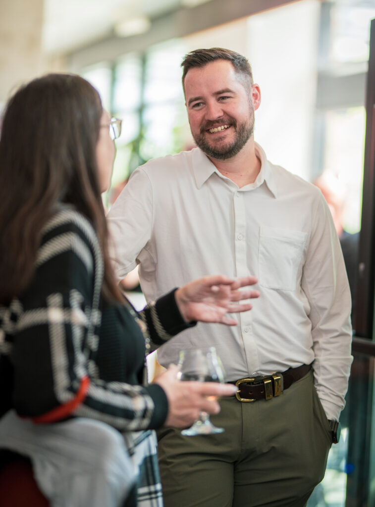 Kristian from Good Sorts chatting with property professionals at PNB